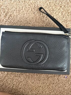 Gucci Black Pebbled Leather Zip Wristlet with Embossed Logo